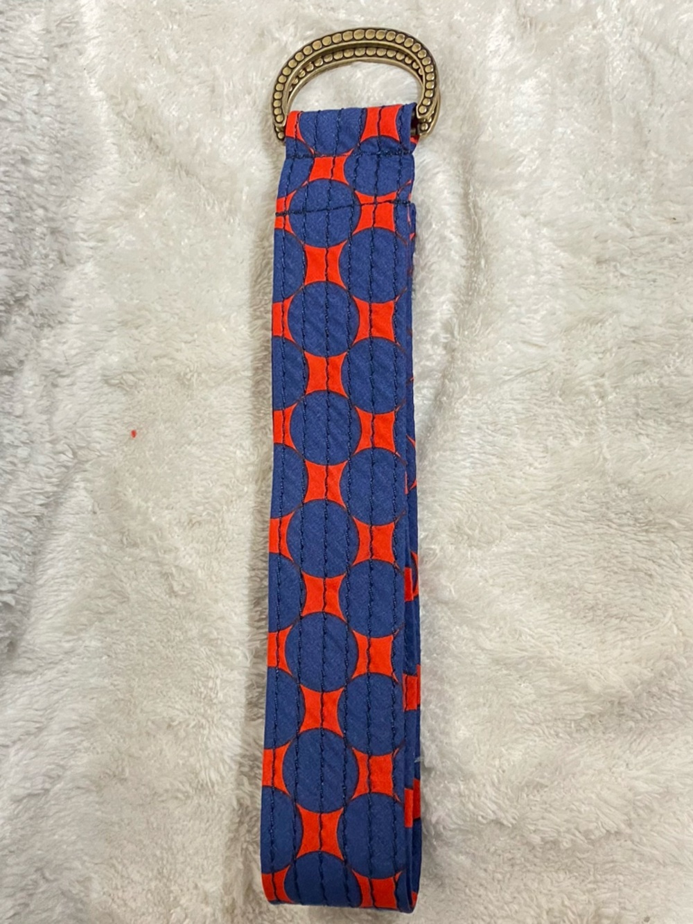 J. Crew Quilted Wrist Strap in Navy and Bright Orange Circle Print